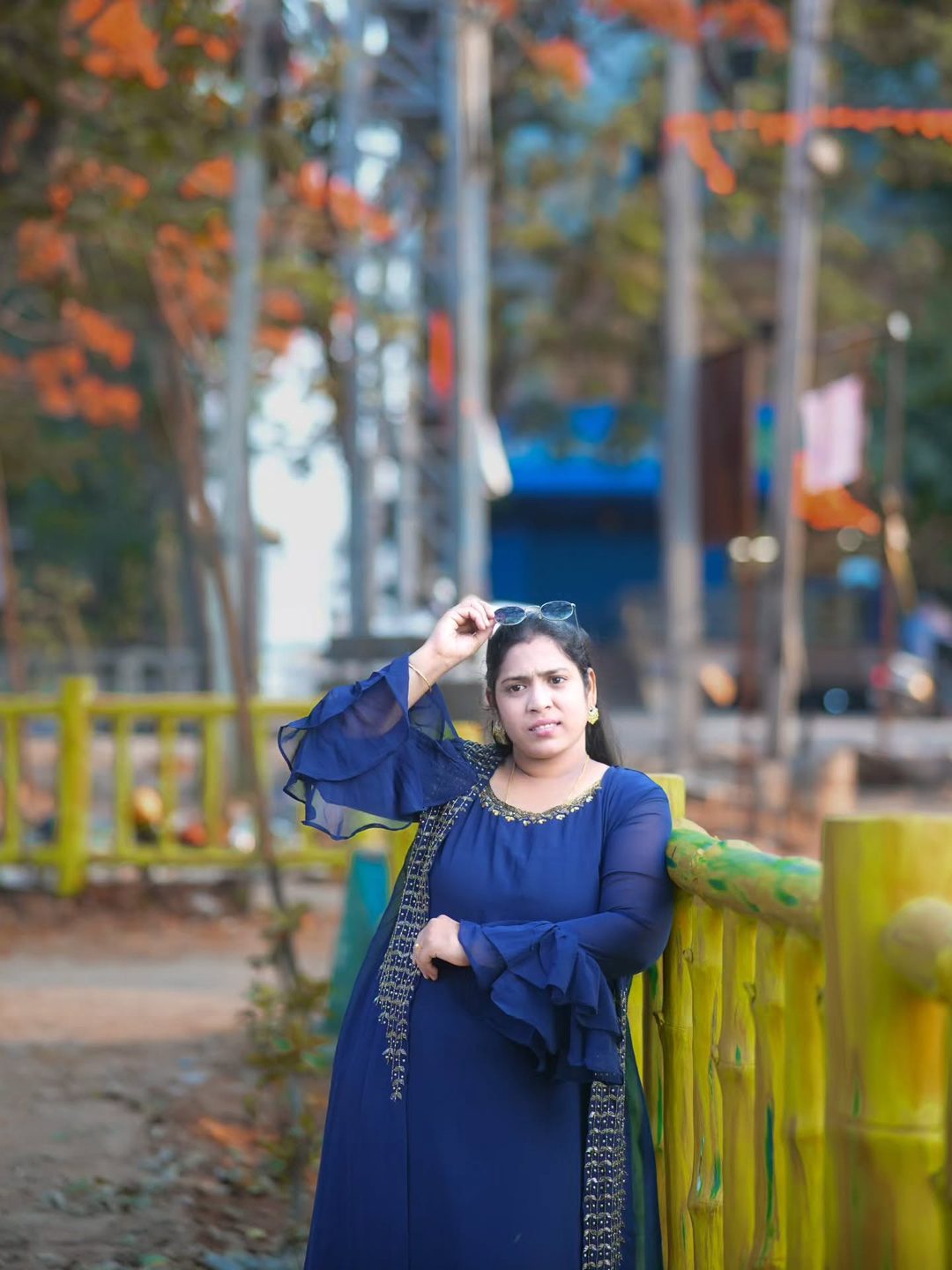 Candid pose by a fence