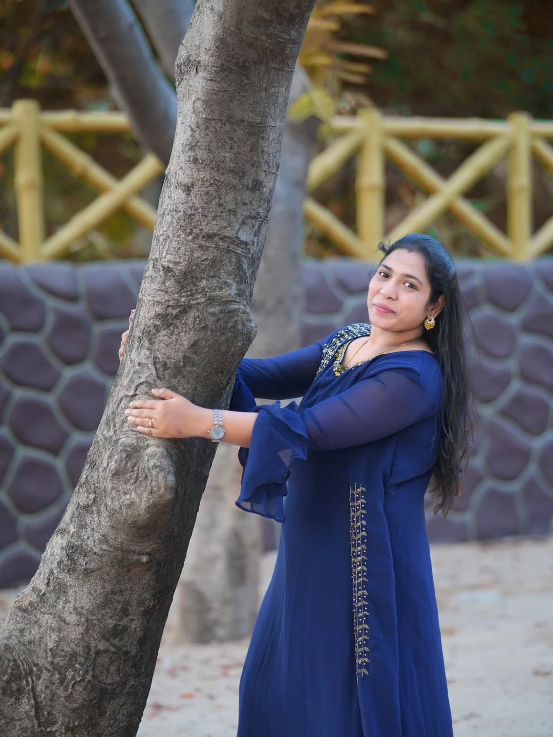 Portrait beside a tree