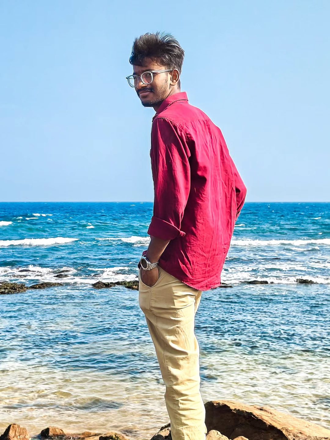 Sea-side portrait in a red shirt