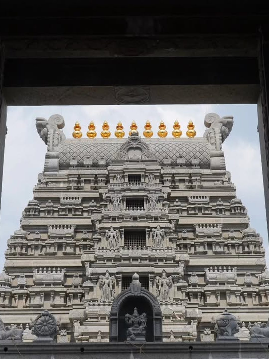 Yadagirigutta temple gopuram framed through a gateway